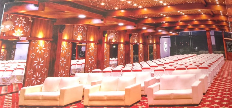 Aura hall lounge seating on a patterned red carpet